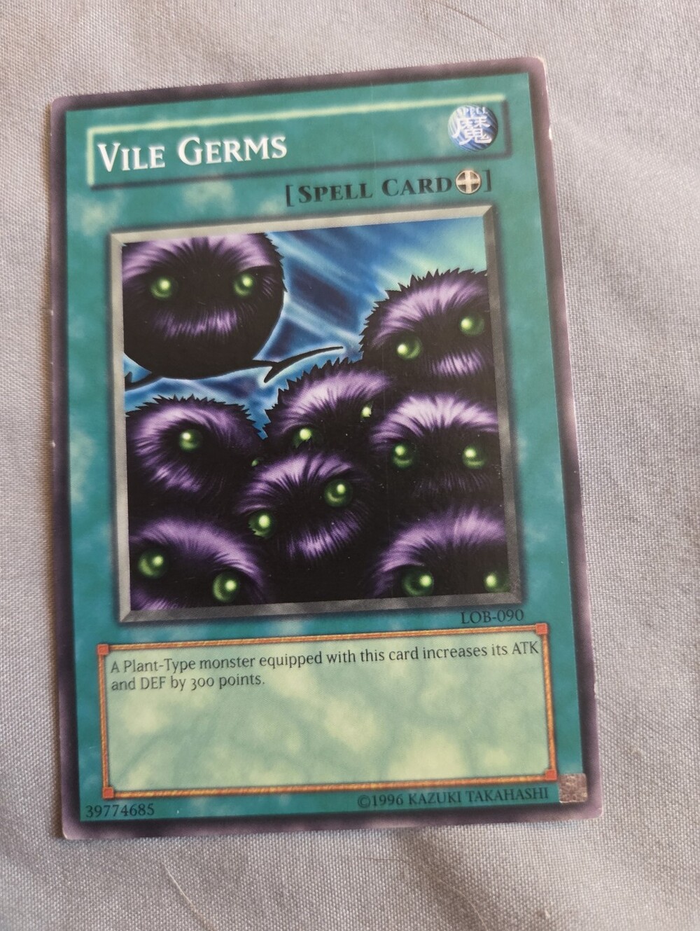 Yu-Gi-Oh! Vile Germs Spell Card - Teal Border, Purple Artwork
